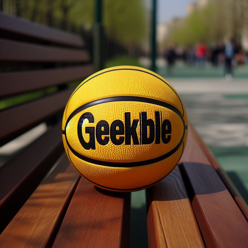 A yellow custom basketball with a logo on a park bench.